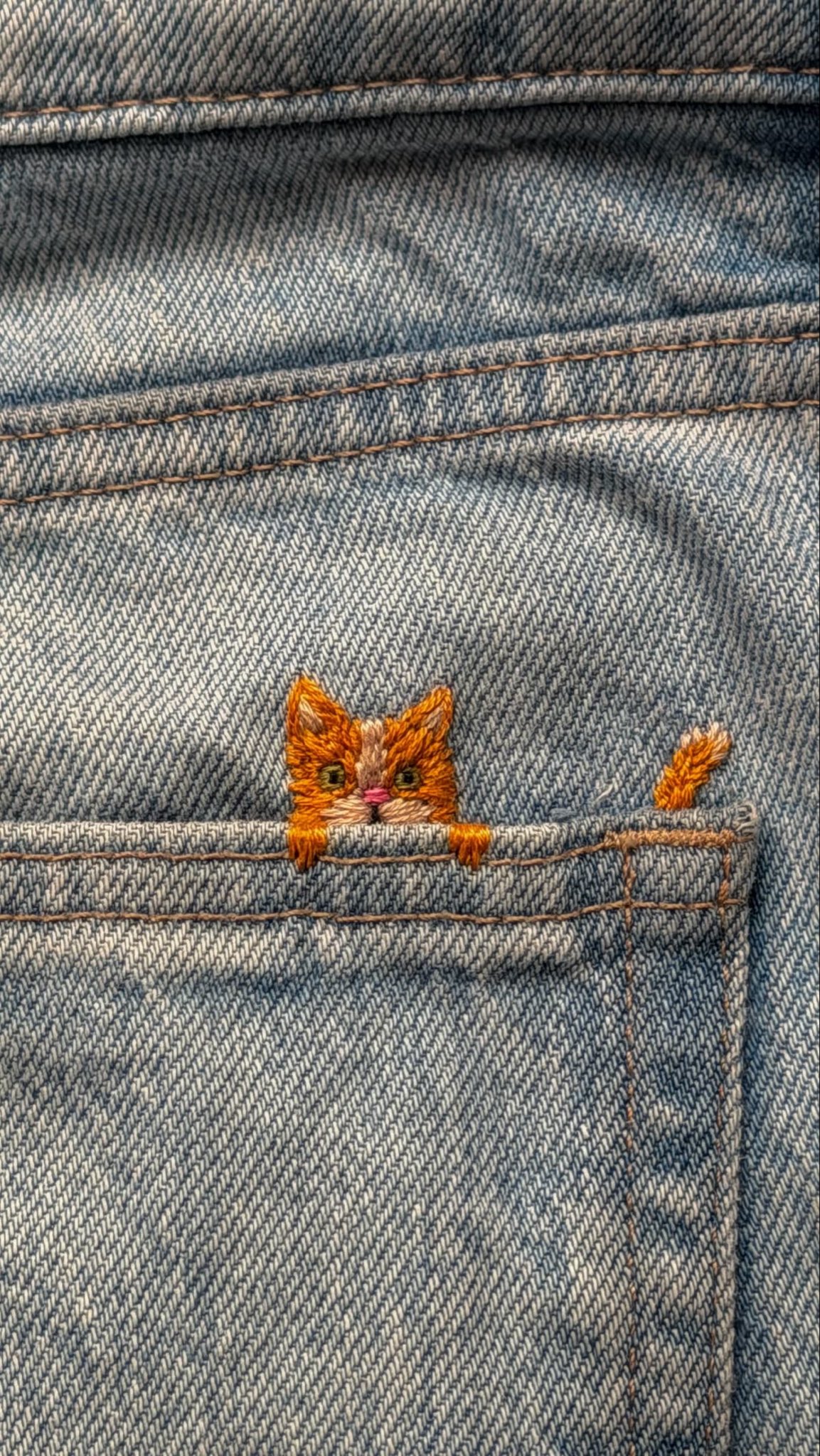 Embroidered climbing cat on denim, image 2